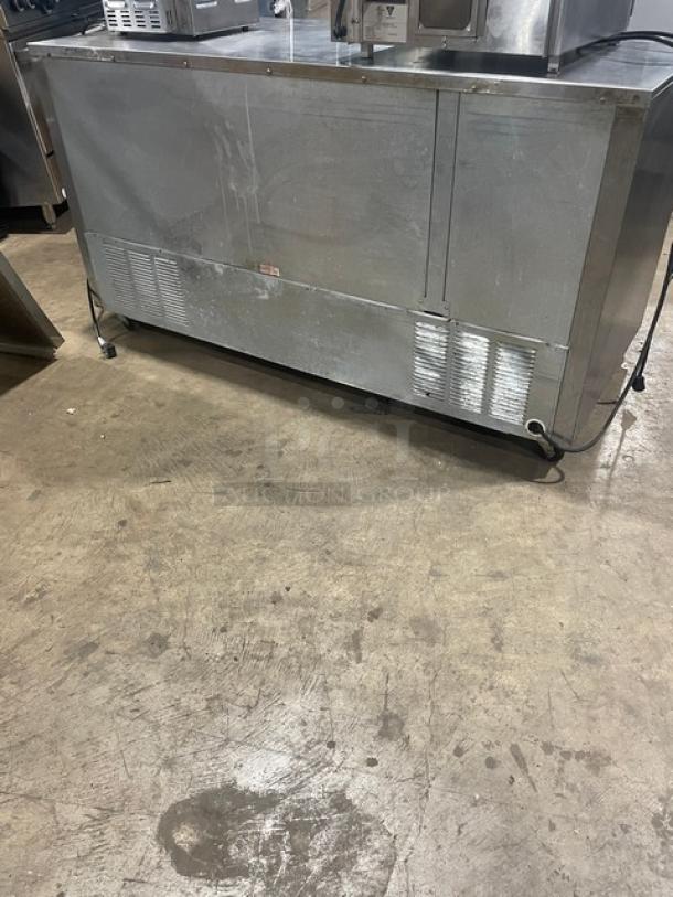 Beverage-Air UCR60A commercial 2-door undercounter refrigerator, stainless steel, poly coated wire racks, on casters.