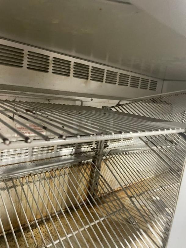 Beverage-Air UCR60A undercounter refrigerator interior with poly coated wire racks, commercial use, 2-door, stainless steel.