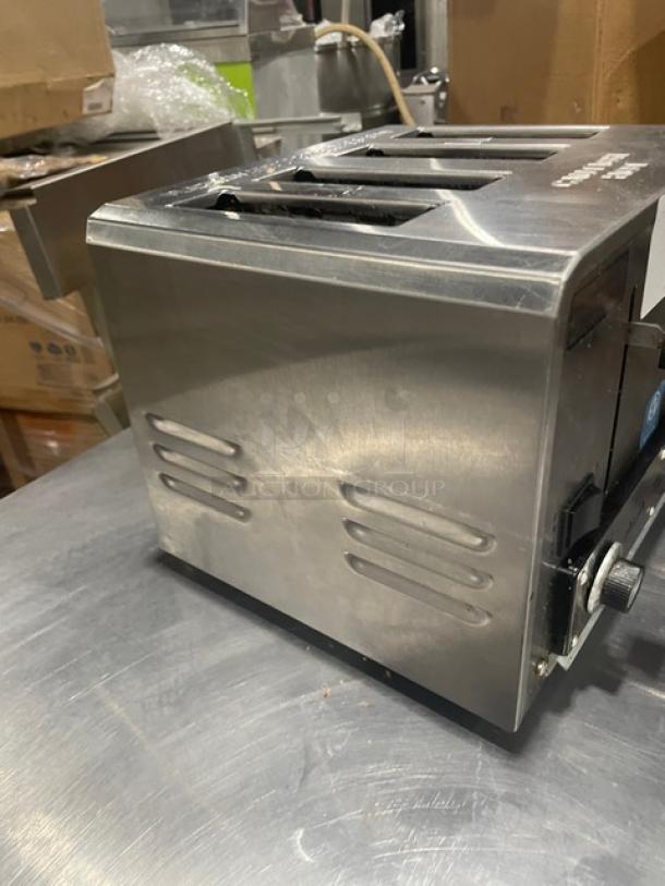 AvaToast CT100 commercial stainless steel 4-slice toaster, model CT-100, used condition, visible dials and vents.