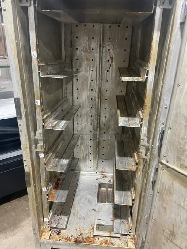Metro Flavor Hold Series insulated, mobile heated holding/proofing cabinet, model C199H1N. Features wide built-in pan slides, visible rust, on casters. 120V.