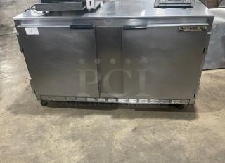Beverage-Air UCR60A commercial 2-door stainless steel undercounter refrigerator with poly-coated wire racks, on casters.