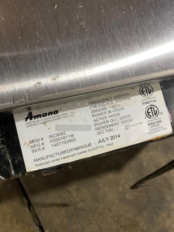 Amana 2014 stainless steel commercial microwave, Model RC30S2, 208/230V, 4000W. Features programmable touchpad controls.