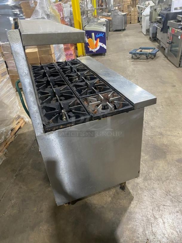 Bakers Pride 10-burner stainless steel gas range with double oven, backsplash, salamander shelf, wired racks, Model 60BP10BS26N.