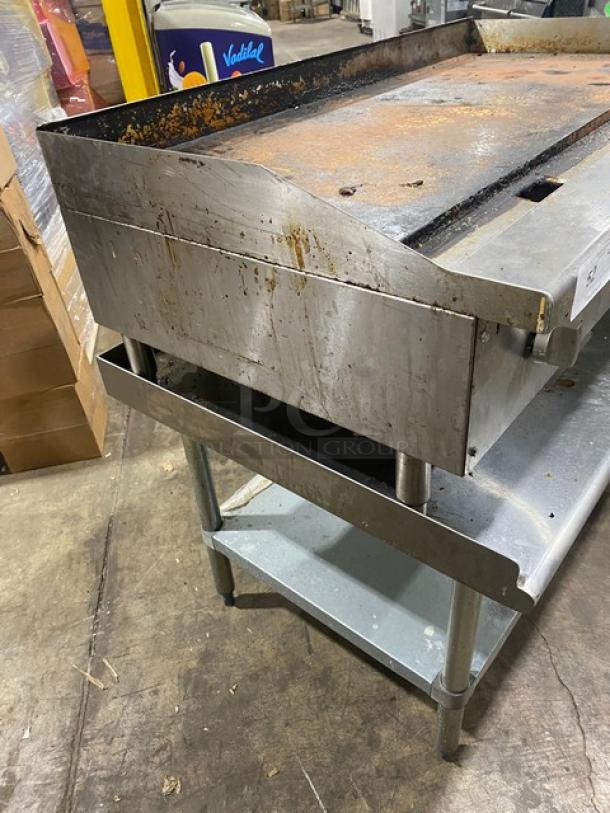 L&J stainless steel natural gas countertop flat griddle, model JRMG48NG, with undershelf, back and side splash, used condition.