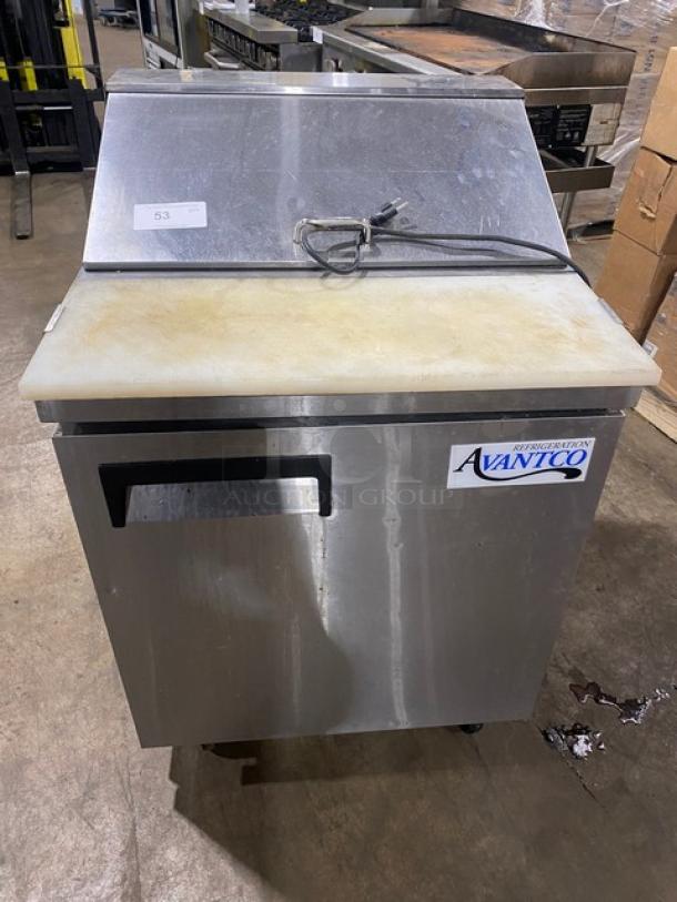 Avantco stainless steel single door refrigerated prep table with cutting board and poly-coated wire rack on casters.