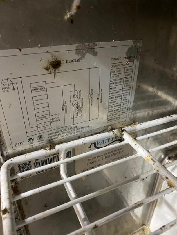 Avantco stainless steel refrigerated prep table with circuit diagram and technical parameters label. Includes poly-coated wire rack.