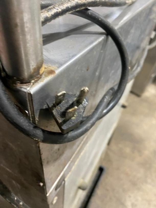 True TSSU-27-08 prep table plug and power cord detail. Stainless steel, commercial grade, 115V, on casters.
