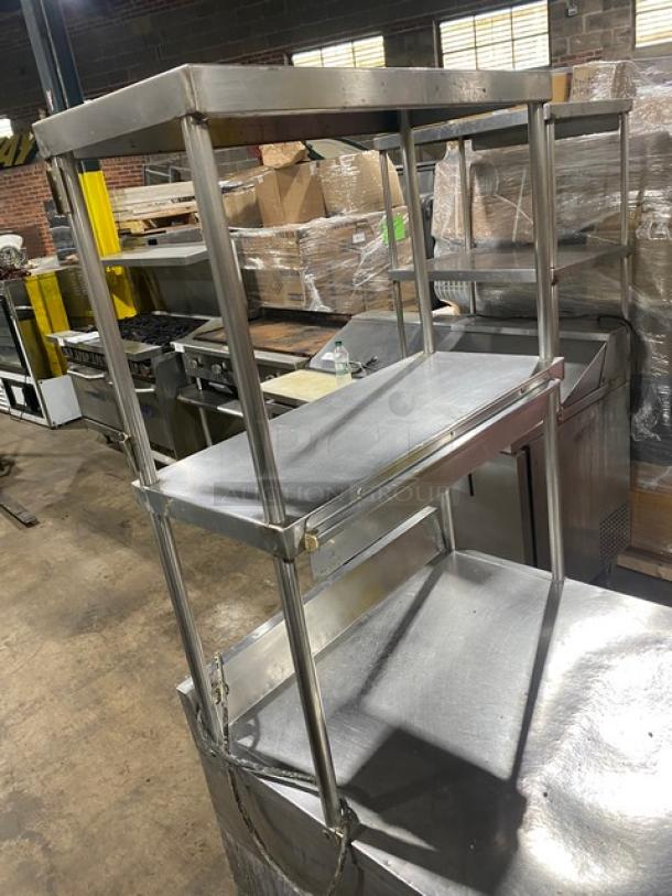 True TWT-27 stainless steel single door worktop refrigerator with backsplash, double overhead shelves, and poly coated wire racks.