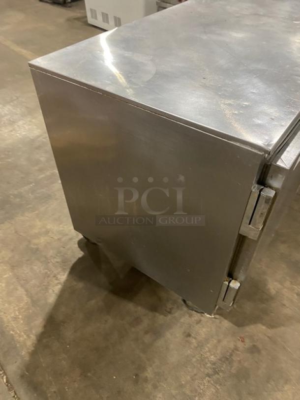 Beverage-Air stainless steel 3-door undercounter fridge, model UCR72A, on casters. Comes with poly coated wire racks.