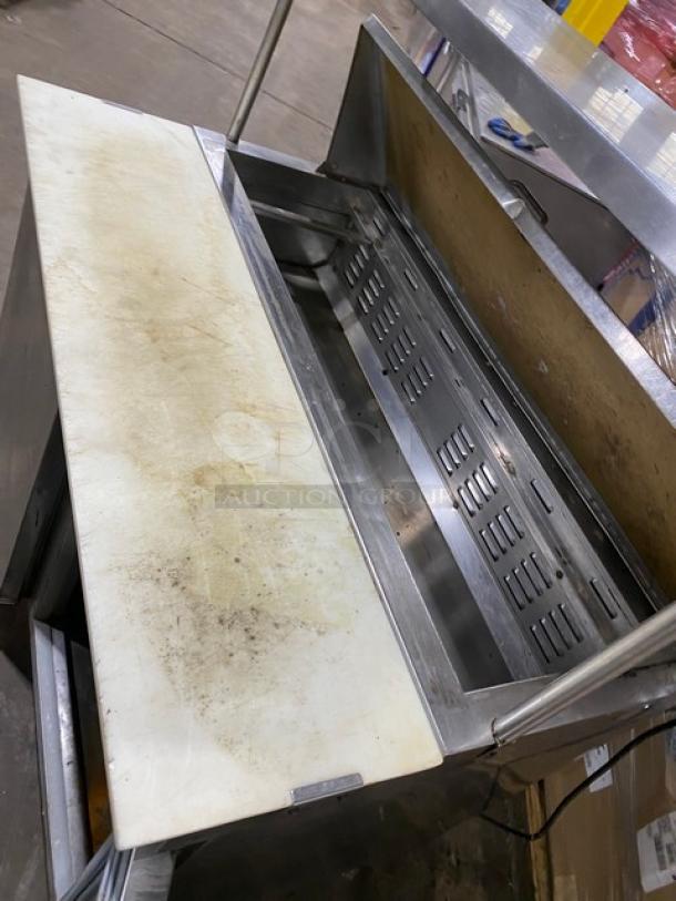 Commercial stainless steel refrigerated prep table with two doors, Bain Marie style, double overhead shelf, Hatco strip warmer, on casters.