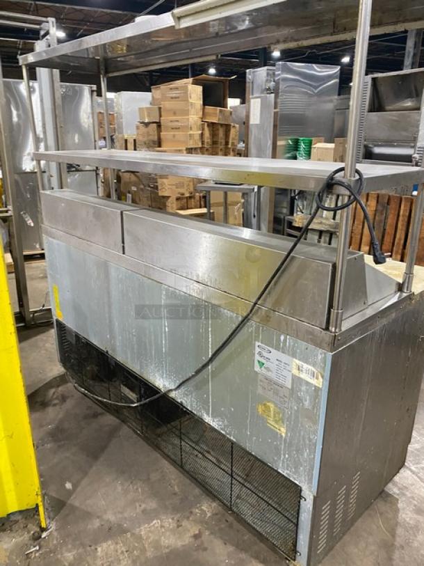 Kool-It 3-door stainless steel refrigerated prep table, model KSP72, with cutting board, double overhead shelf, and casters.