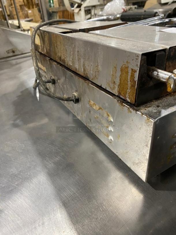 Avantco commercial stainless steel electric panini grill with thermostatic control, dual grooves, used condition, countertop model.