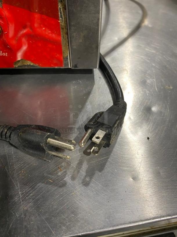 Avantco electric dual panini grill plug detail, showing power cord with two-prong and three-prong connectors.