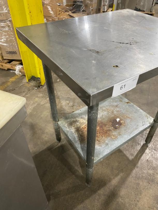 Aero commercial stainless steel worktop table with single undershelf. Features include durable legs and visible wear on the shelf.