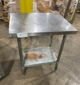 Aero stainless steel worktop table with single undershelf. Used condition with visible wear. On sturdy legs.