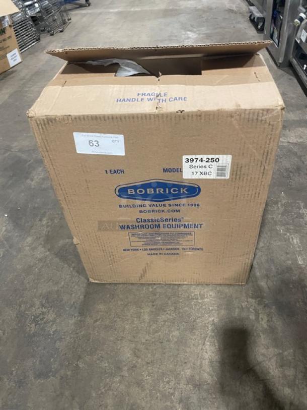New Bobrick C-Series stainless steel automatic paper towel dispenser, Model 3974-250, in original packaging.