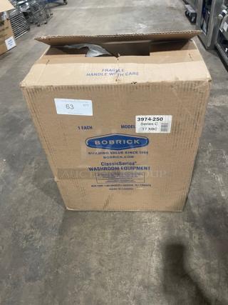 New Bobrick C-Series stainless steel automatic paper towel dispenser, Model 3974-250, in original packaging.
