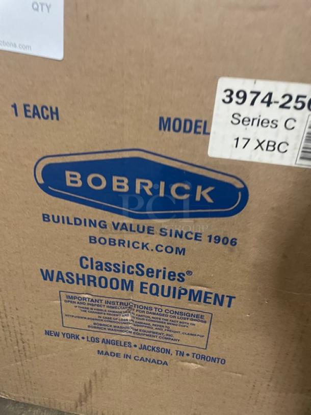 NEW Bobrick C-Series stainless steel automatic paper towel dispenser, Model 3974-250, in original packaging.