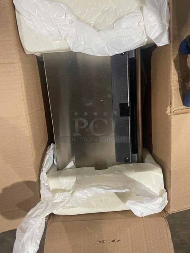 New Bobrick C-Series stainless steel convertible automatic paper towel dispenser, Model 3974-250, in original packaging.
