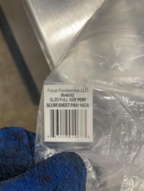 Focus Foodservice aluminum mesh perforated bun pan, model 904692. New condition, full-size, 16 gauge. Barcode label visible.