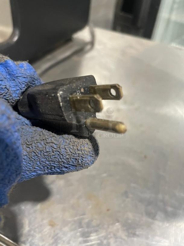 Close-up view of an electric plug for the Star HPDE2 condiment warmer, showcasing the power connector details.