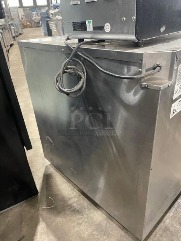 FWE stainless steel electric warming cabinet, Model HLC-SL1826-8-CHP, with wired racks, on casters, 120V, 1 phase.