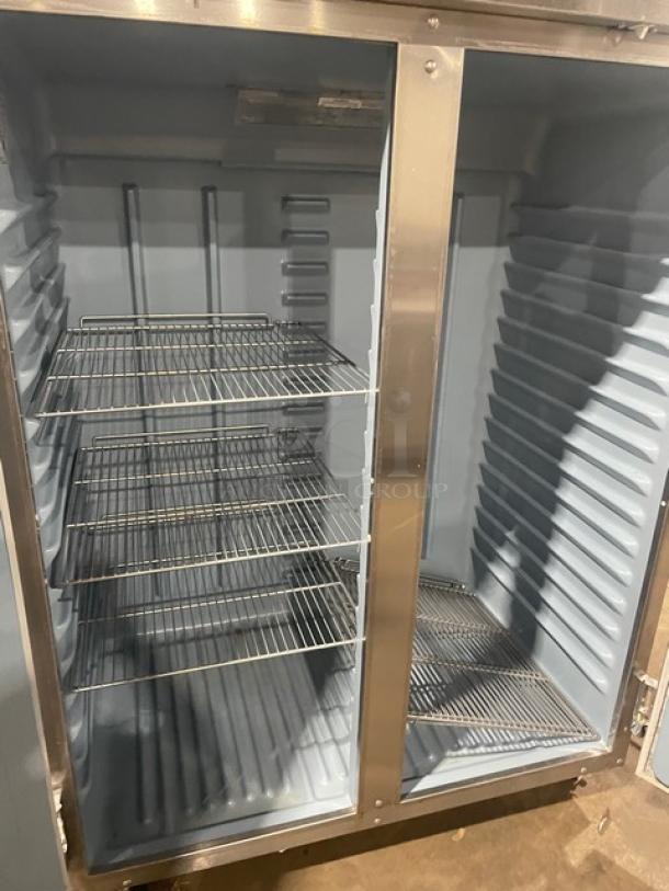 Delfield 6000XL Series 2-door reach-in freezer, stainless steel, model 6151XLS, with poly-coated wire racks, on casters.