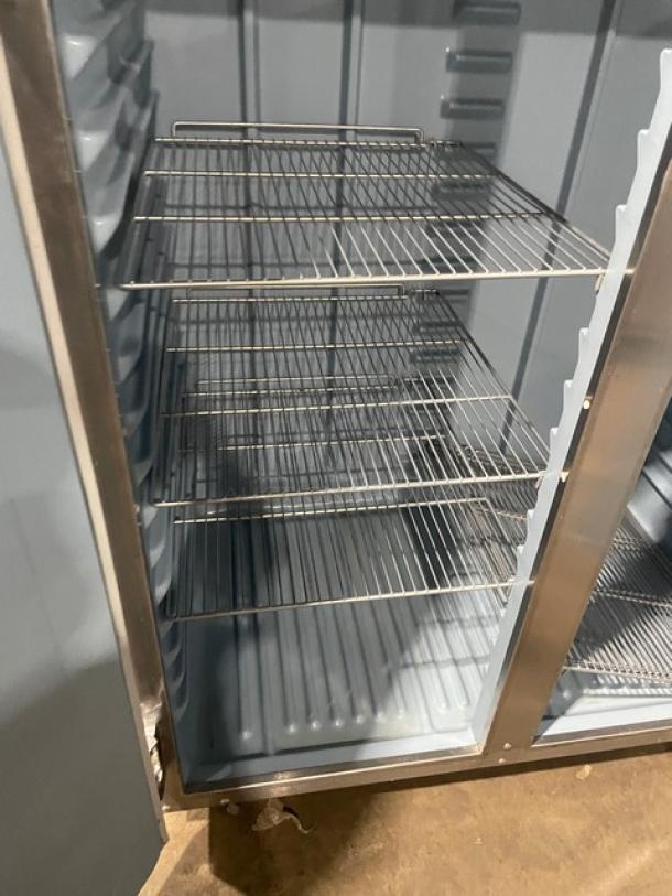 Delfield 6151XL-S commercial stainless steel 2-door reach-in freezer with poly coated wire racks, on casters. Energy Star certified.