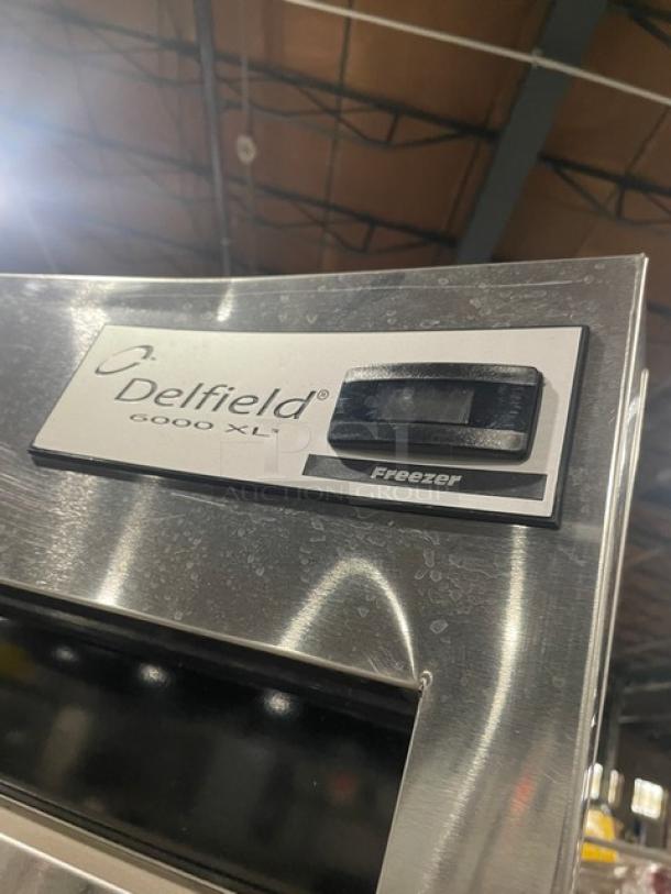 Delfield 6000XL Series 6151XL-S stainless steel commercial freezer, showing logo and model on front panel.