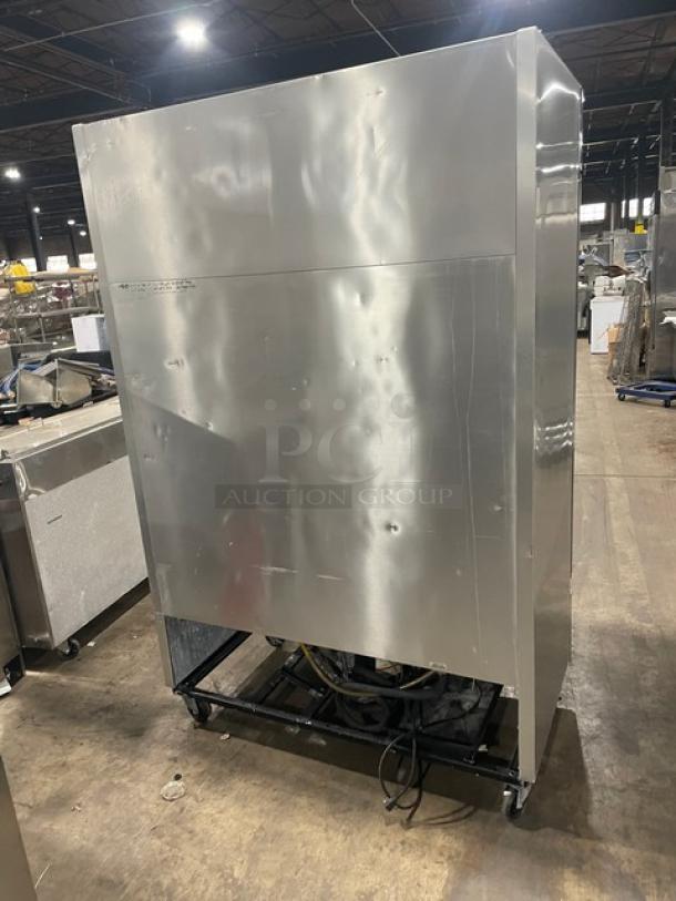 True T-49 commercial stainless steel 2-door refrigerator with poly-coated wire racks, model T-49, on casters.