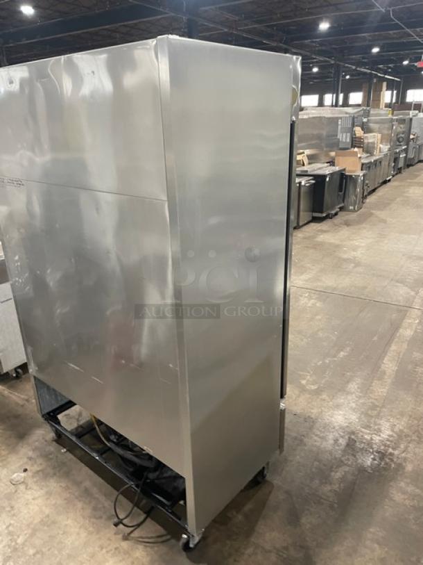 True T-49 commercial stainless steel two-door refrigerator on casters, with poly-coated wire racks, model T-49, SN: 1-4201173.