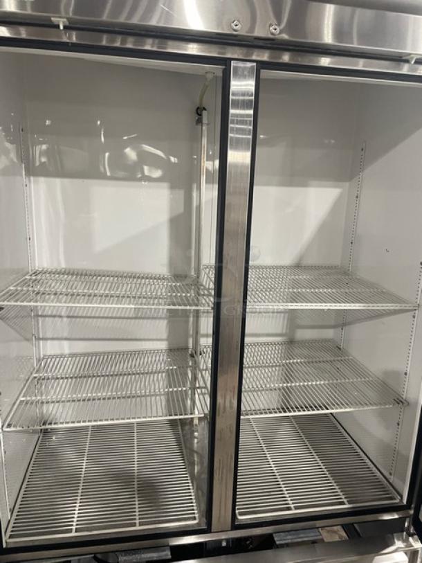 True T-49 commercial stainless steel 2-door refrigerator with poly-coated wire racks, serial number 1-4201173, on casters.