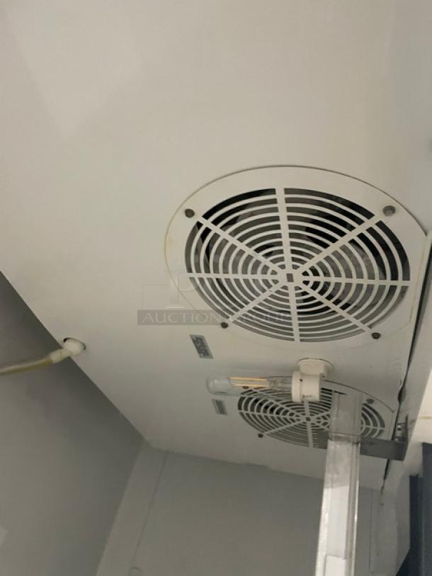 True T-49 refrigerator interior fan and light. Features stainless steel build, poly-coated wire racks, on casters, 115V, 1 phase.