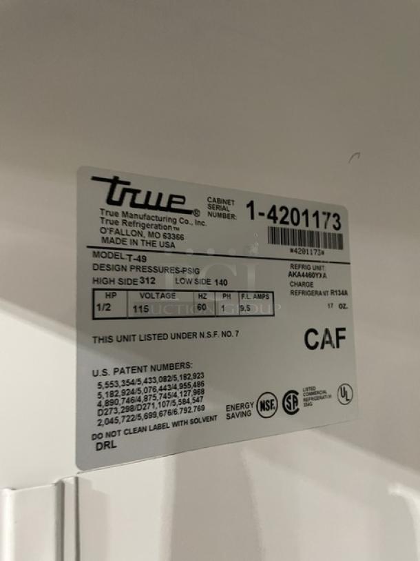 True T-49 stainless steel 2-door commercial refrigerator with poly-coated wire racks, on casters, model SN: 1-4201173. Made in USA.