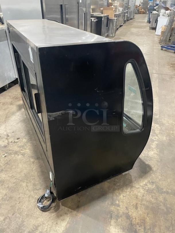 Tor-Rey black 57" refrigerated deli display, model TEM150NL-UL, with curved glass, stainless interior, and sliding doors.