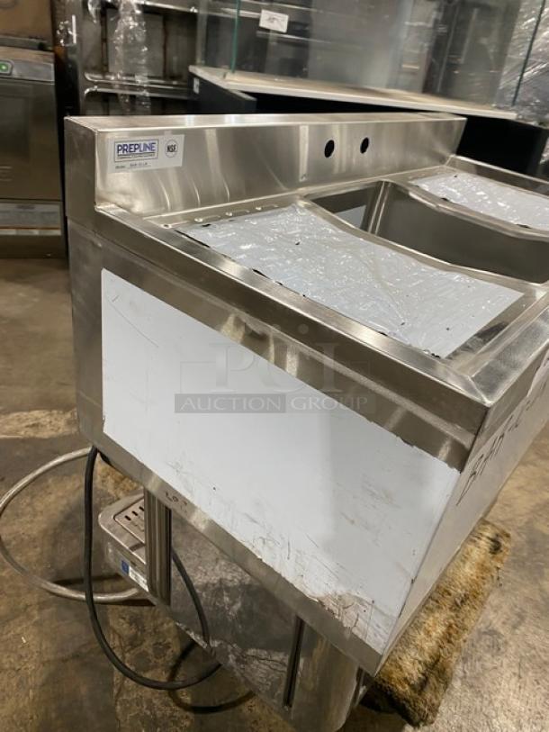 Prepline stainless steel underbar handwashing sink, model BAR-1C-LR, with faucet, legs, and 3" backsplash. Includes left/right drain board. Scratch-and-dent condition.