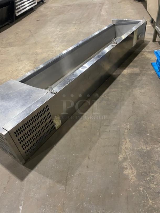 Avantco stainless steel refrigerated countertop prep rail, used condition, features vented panel and durable metallic finish.