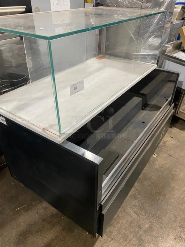 Starbucks style black refrigerated merchandiser display case, multi-level, with top enclosed glass showcase, on legs.