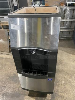 Manitowoc SPA160 stainless steel hotel ice dispensing bin with push dispenser, drip tray, and legs. 120 lb capacity, 115V, 1 phase.