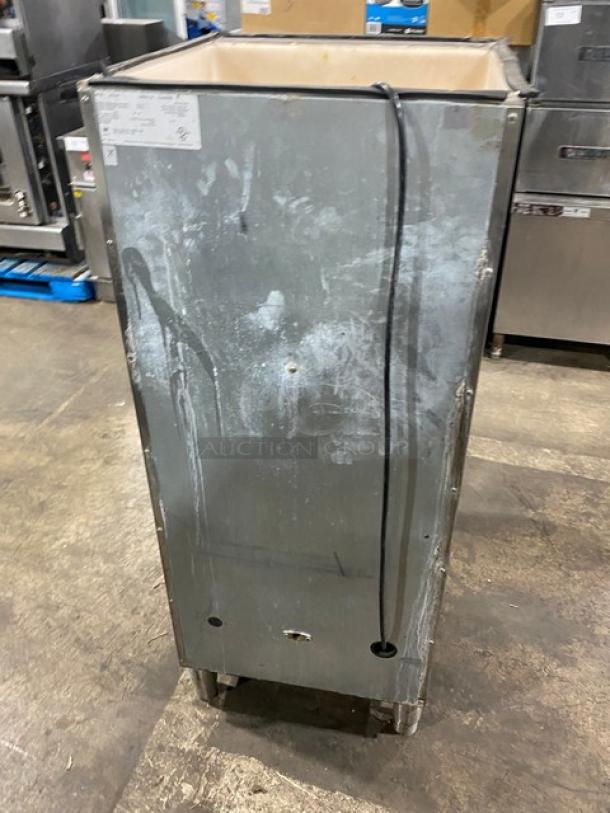 Manitowoc SPA160 ice dispensing bin, stainless steel, 120 lb capacity, with push dispenser, drip tray, on legs, 115V, used condition.