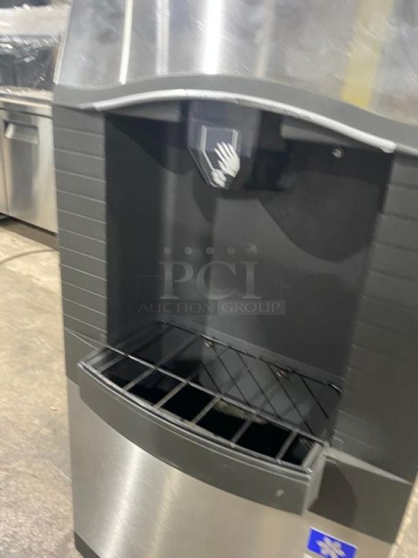 Manitowoc SPA160 stainless steel ice dispensing bin with push dispenser, drip tray, 115V, 1 phase, on legs, 120 lb capacity.
