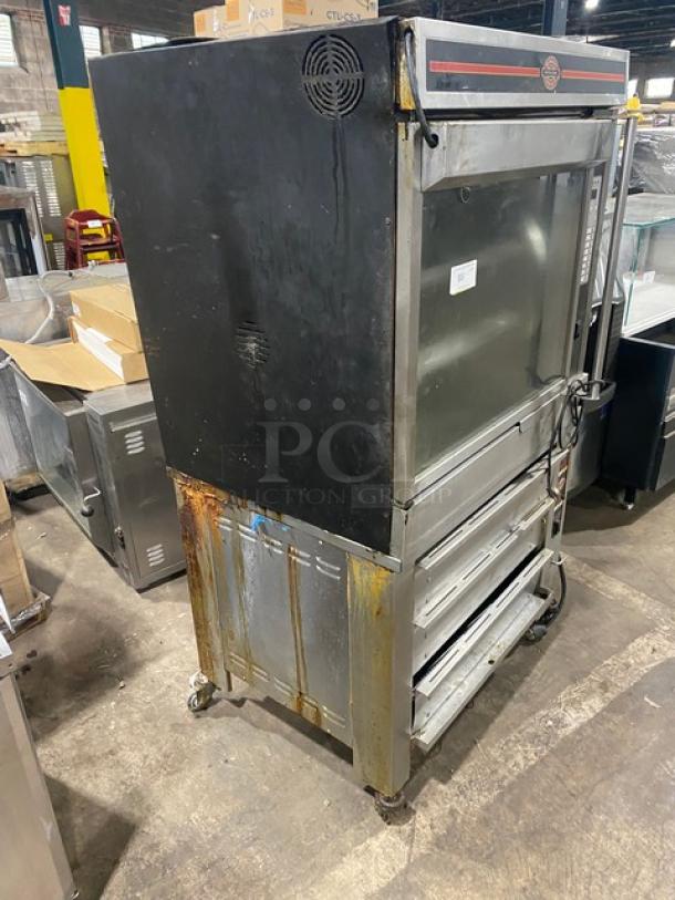 Cleveland Range commercial stainless steel gas rotisserie oven and electric warmer, models BMR32/BMW334, on casters, worn condition.