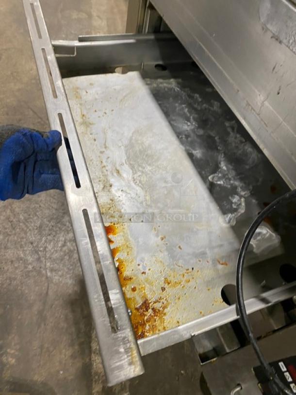 Cleveland Range commercial stainless steel food warmer drawer, model BMW334, with visible wear and food residue.