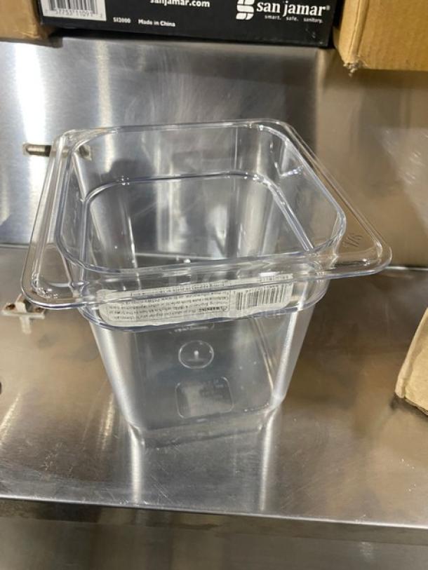 Brand new Cambro Camwear Series 1/6-size 6" deep clear polycarbonate food pan, model 66CWTRI135, shown on a metal surface.