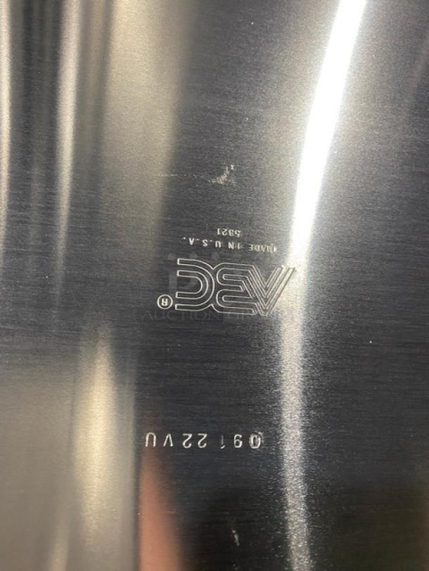 Brand new ABC Commercial Aluminum 1/2-Size Sheet Pan, Model 5321. Features durable aluminum, marked "Made in USA".