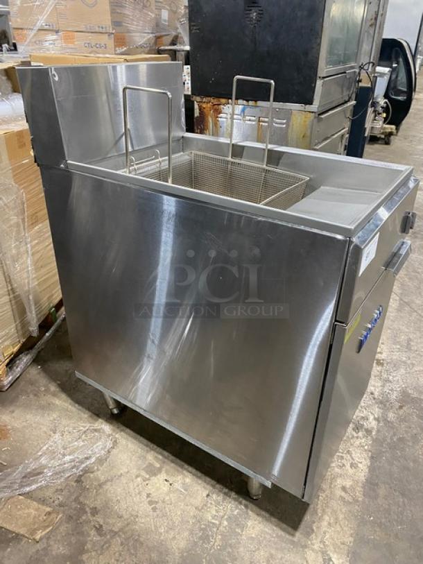 Imperial IFS75E stainless steel electric deep fat fryer, 75 lb capacity, with backsplash and fry basket, on legs, model SN: 03214921.