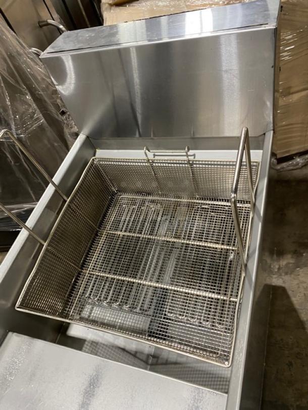 Imperial IFS-75-E stainless steel deep fat fryer with splash guard and basket, 75 lb. capacity, on legs, 208V 3 phase.