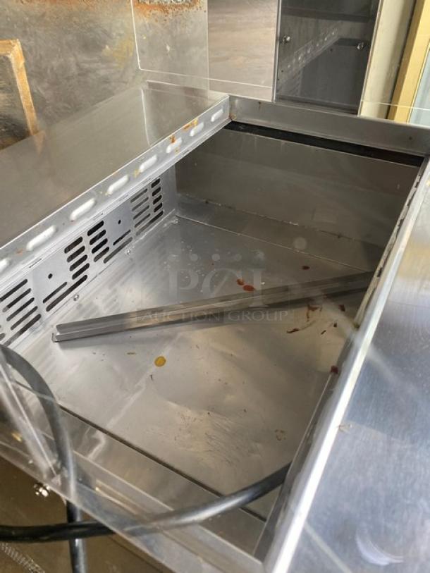 Turbo Air M3 Series refrigerated prep table, MST28N711S, stainless steel, single door, with sneeze guard and wire rack.