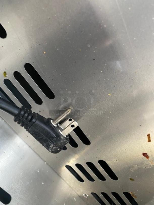 Turbo Air MST-28-N-711S power cord and ventilation details, showing stainless steel surface and standard plug connection.