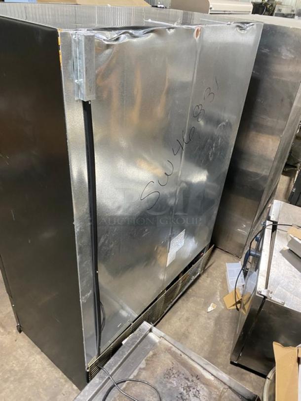 Kool-It commercial freezer, model 163LX46FB, with double glass swing doors and poly-coated wire racks. Black finish, late model.